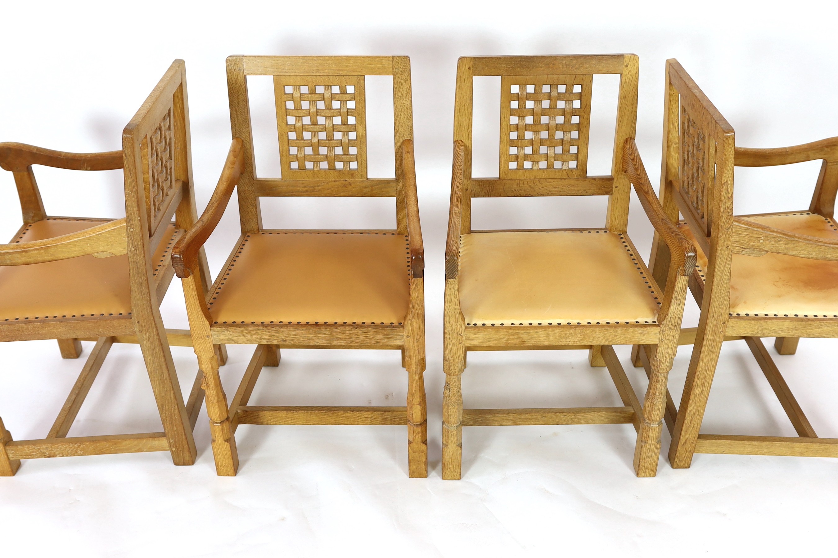 A set of four Robert Thompson 'Mouseman' oak armchairs W.52cm D.52cm H.90cm